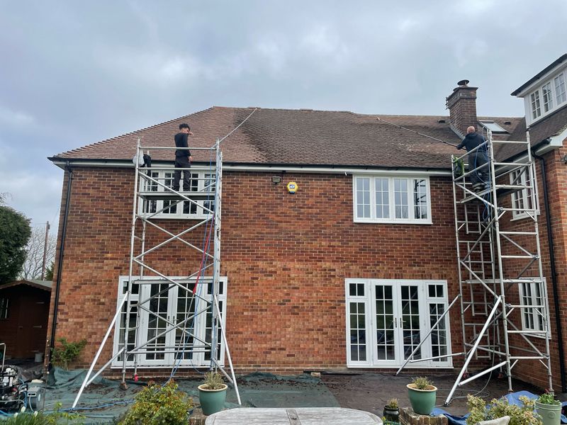 Roof cleaning carried out safely from scaffold towers by The Roof Moss Cleaners in Baldock